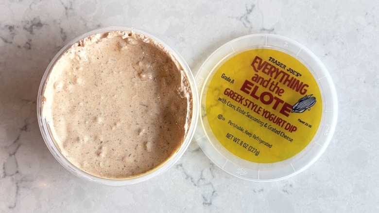 An open container of Trader Joe's Everything And the Elote Greek Style Yogurt Dip
