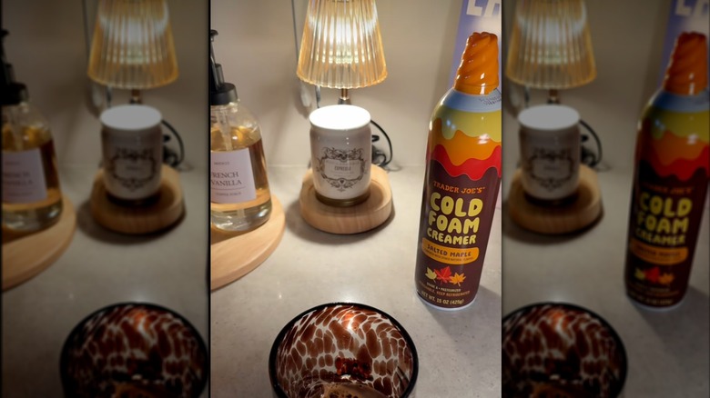 Bottle of Salted Maple Cold Foam Creamer with cup of coffee