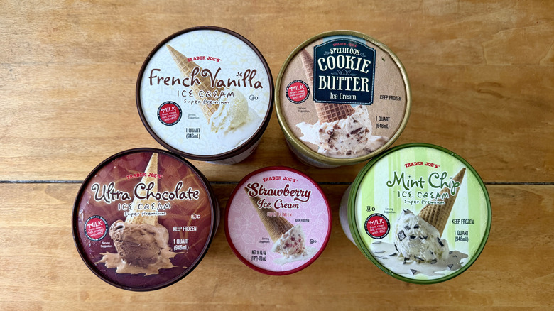 An aerial view of various Trader Joe's ice creams on a wooden table