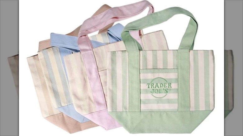 Trader Joe's mini tote bags are pastel green, pink, blue, and taupe