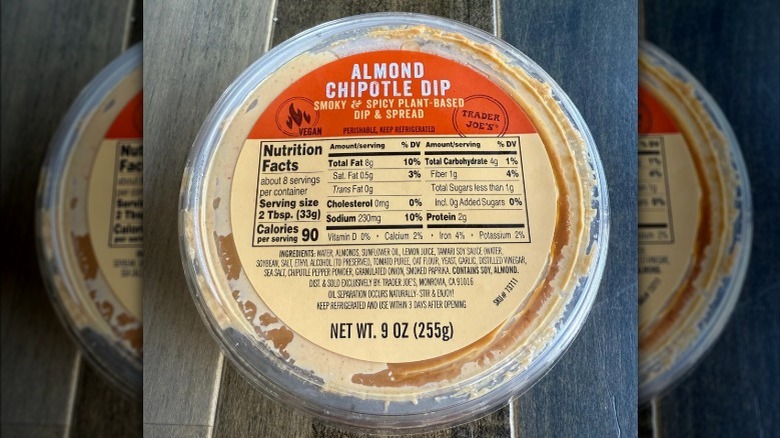 A closed container of Trader Joe's Almond Chipotle Dip