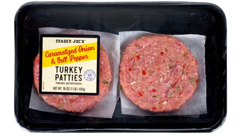 A package of Trader Joe's Caramelized Onion & Bell Pepper Turkey Patties on a white isolated background