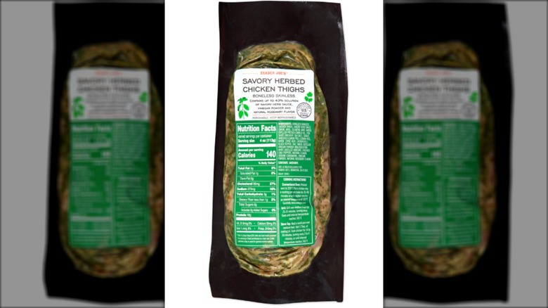 A package of Trader Joe's Savory Herbed Chicken Thighs on a white isolated background