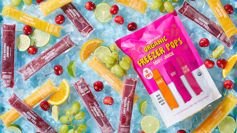 Bag and assortment of Trader Joe's Organic Freezer Pops surrounded by fresh fruits