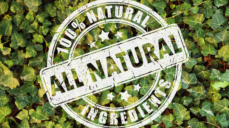 100% All Natural logo over a bed of ivy