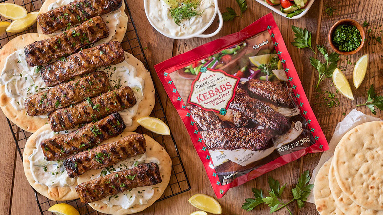 A package of Trader Joe's Middle Eastern Style Kebabs next to a cooked version