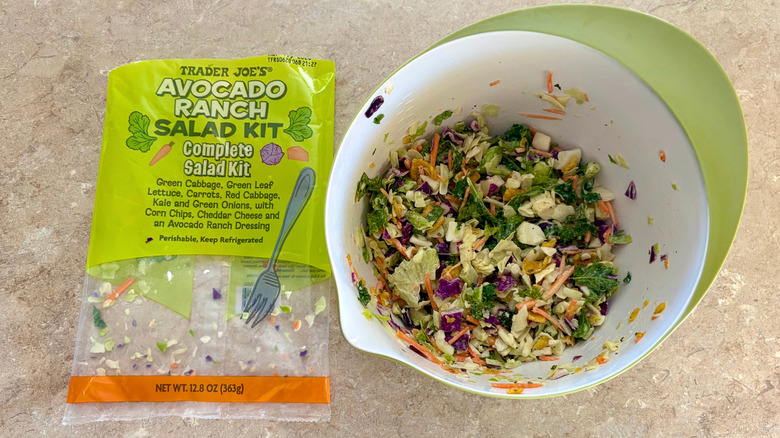 A prepared Avocado Ranch Salad next to its empty bag