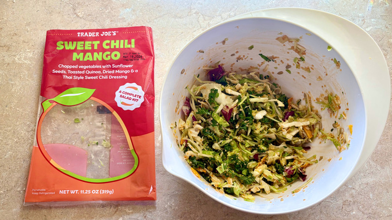 A prepared Sweet Chili Mango Salad next to its empty bag