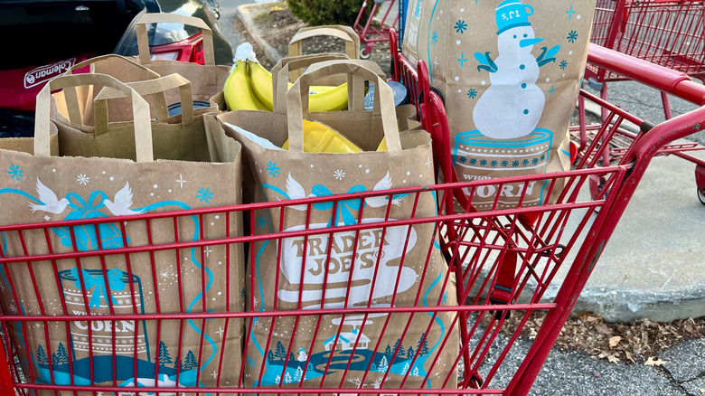Cart filled with Trader Joe's grocery bags