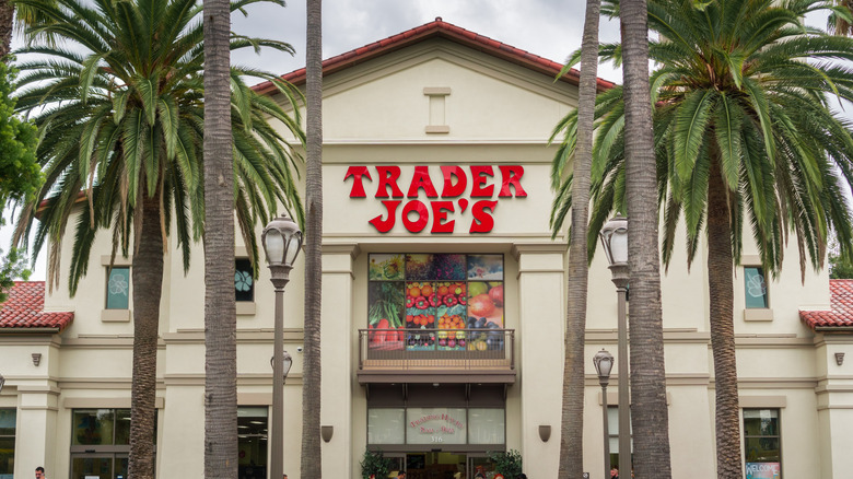 A Trader Joe's store flanked by palm trees