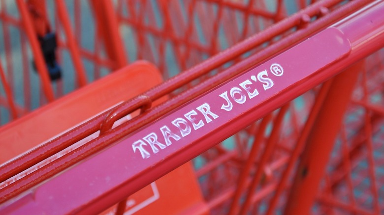 Handle of a Trader Joe's shopping cart