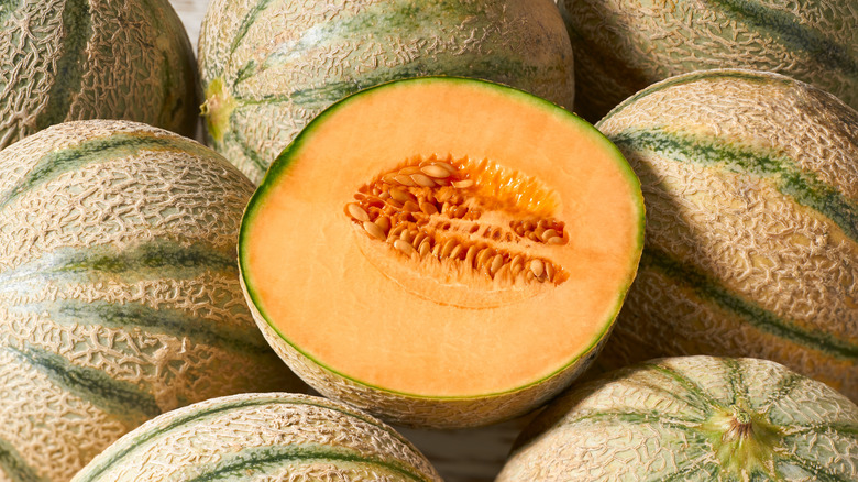 Cantaloupes with one halved one in the center