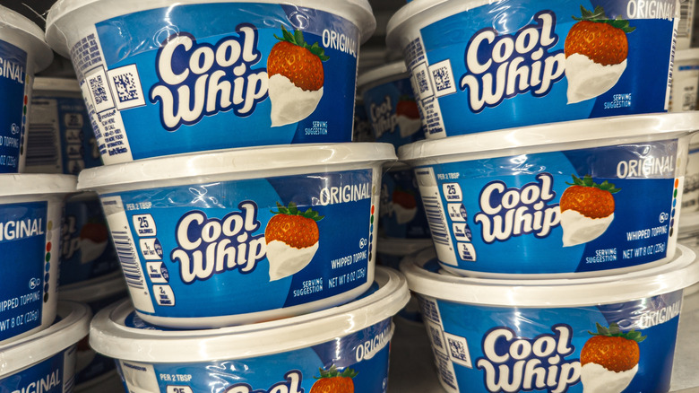 Jars of Cool Whip in grocery store freezer