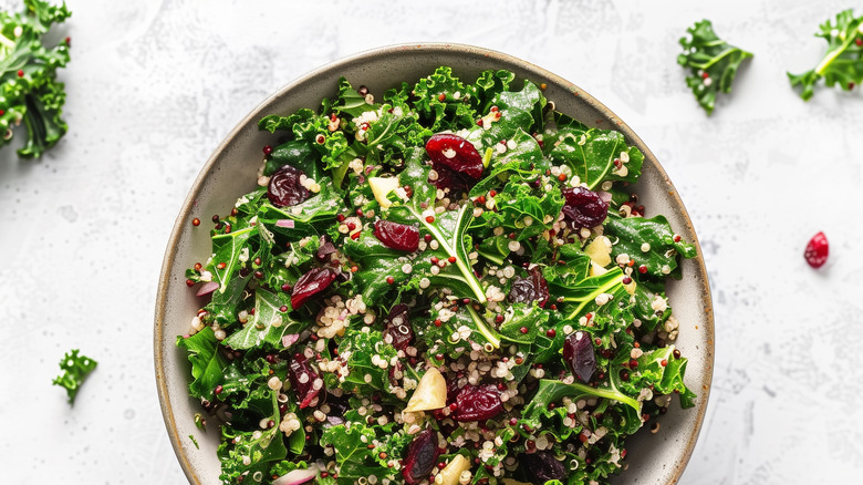 kale and quinoa salad in a ceramic bowl