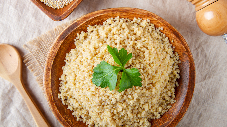 cooked quinoa in a wooden bowl