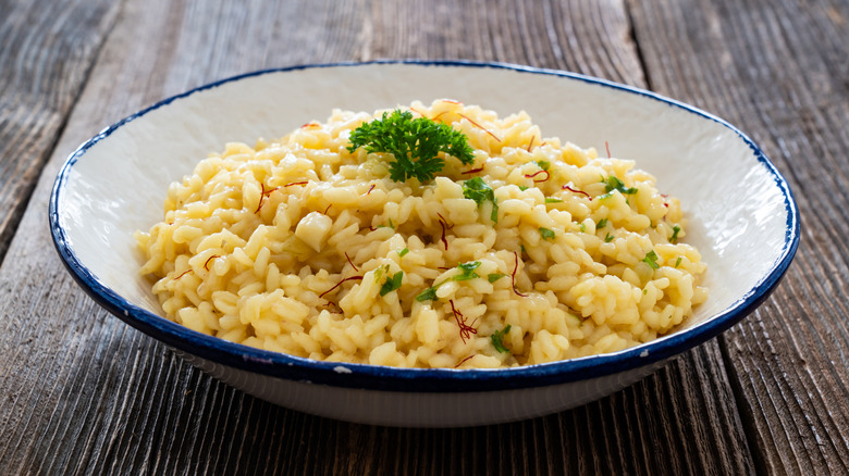Risotto in a white and blue bowl