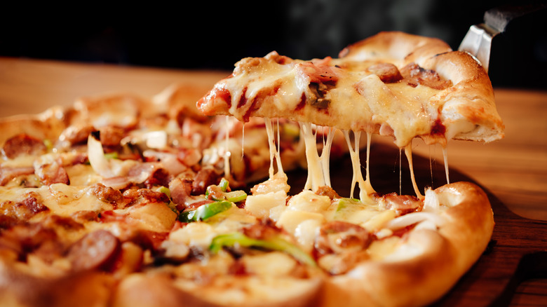 Spatula lifting a slice of pizza