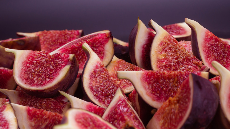 Tasty figs background. Top view. Slices.