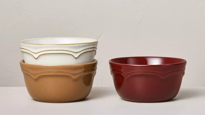 Three bowls from Target in different colors sitting on a gray surface.