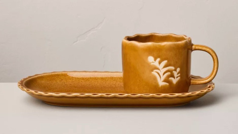 A brown ceramic matching mug and plate set from Target.