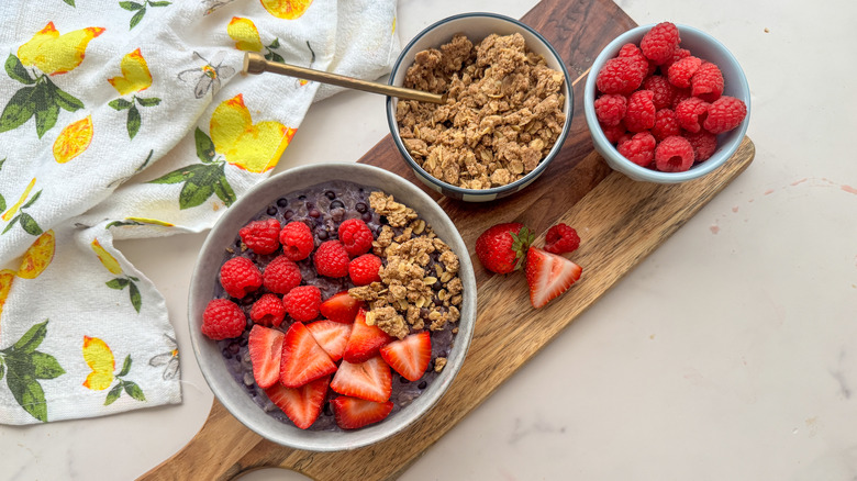 Oatmeal berry bowl with streusel on wood board