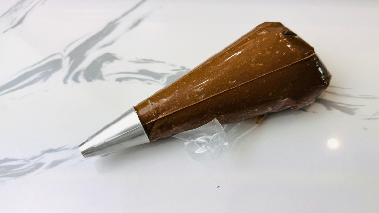 Chocolate batter in piping bag