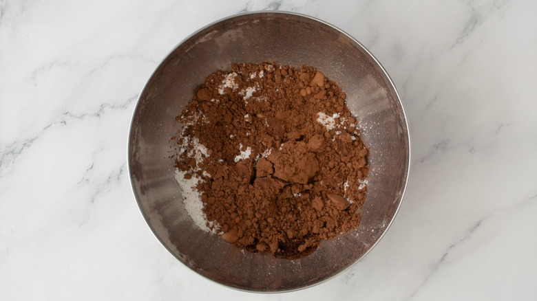 Cocoa powder mixture in bowl on marble surface