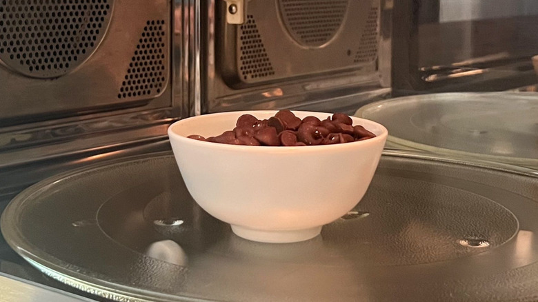 Bowl of chocolate chips in microwave