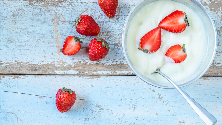a bowl of yogurt with strawberries