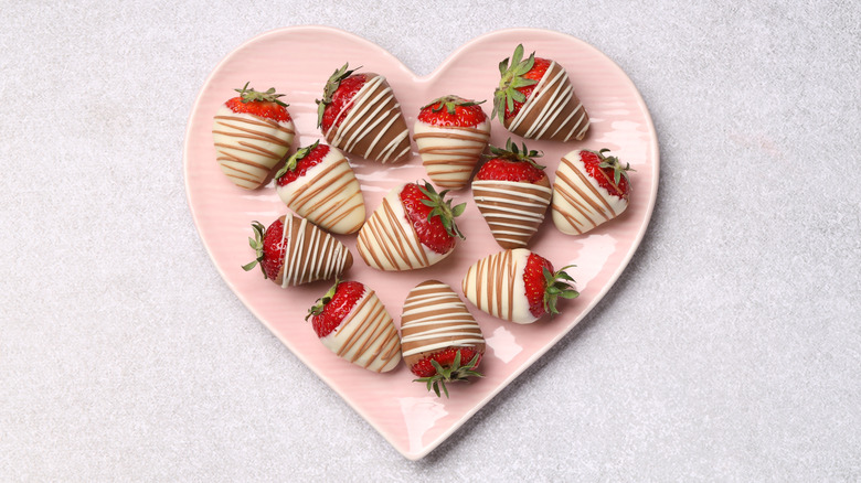 chocolate and yogurt-covered strawberries in a plate