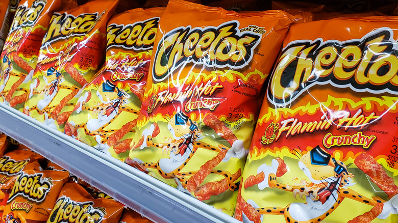 Bags of Flamin' Hot Cheetos on a store shelf