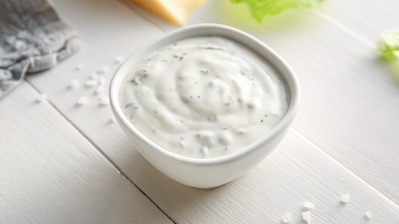 A bowl of Caesar salad dressing