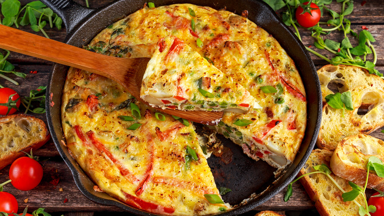 Frittata with roasted vegetables, tomatoes, potatoes, and bacon
