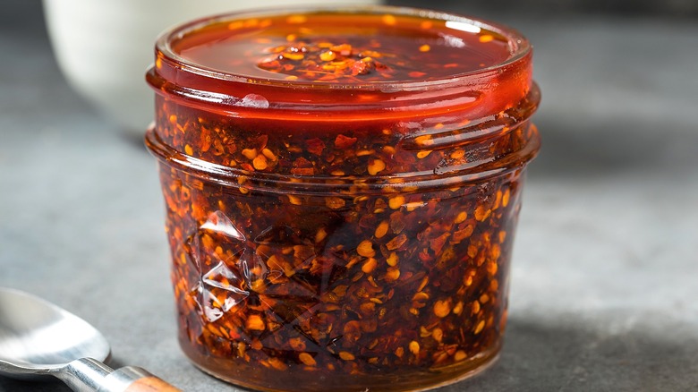 Close-up of chili crisp in a small glass jar