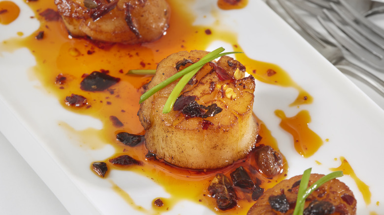Seared scallops with chili oil