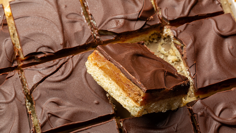 caramel and chocolate layered on a shortbread base