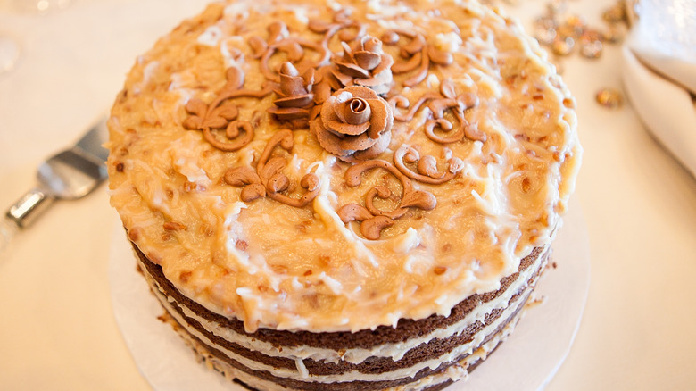 Top-down view of a German chocolate cake with decorative frosting roses