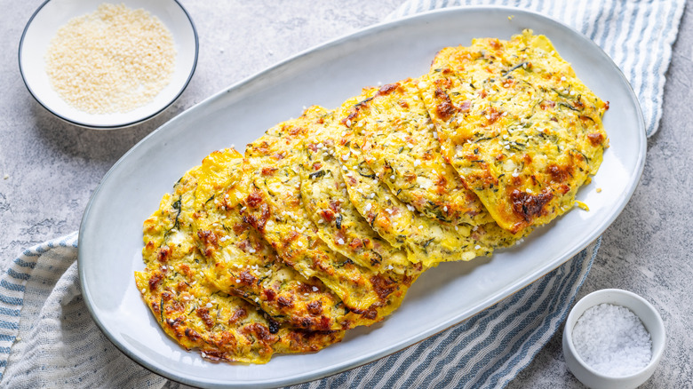 Hobak buchim on white plate sprinkled with sesame seeds and salt
