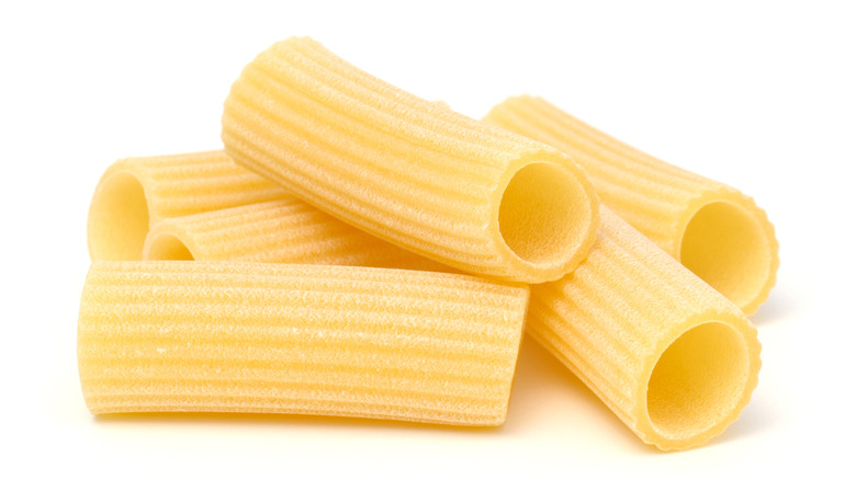 A pile of rigatoni on a isolated white background