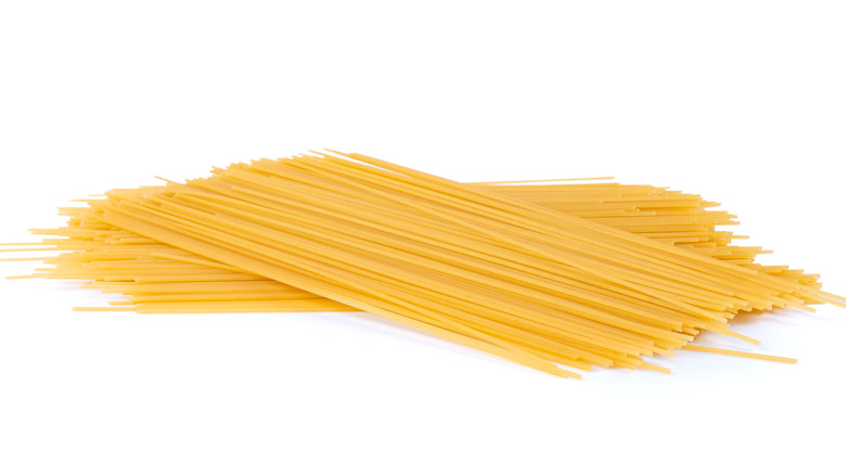 uncooked spaghetti in a isolated white background