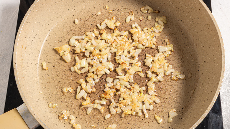 Skillet with cooked chopped onion