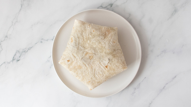 crunch wrap smash burger seam side down