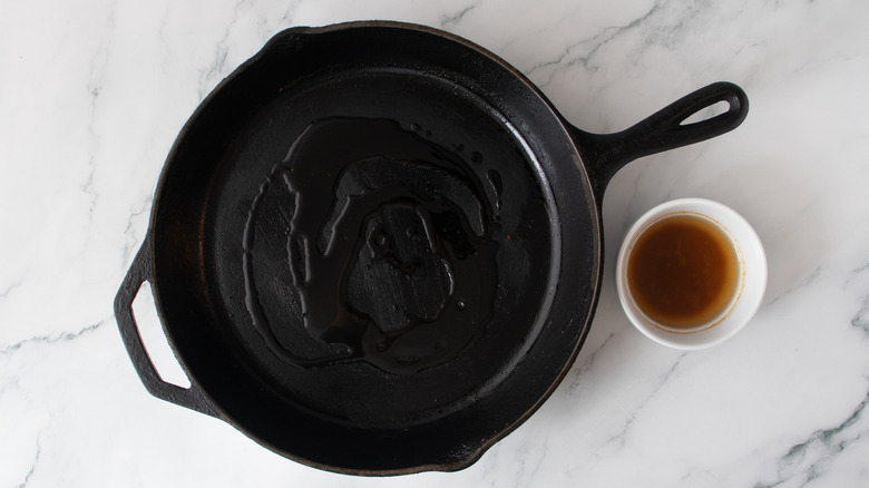 cast iron skillet with burger drippings