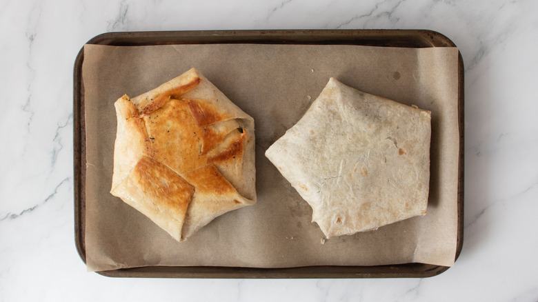 two crunchwraps on a baking sheet