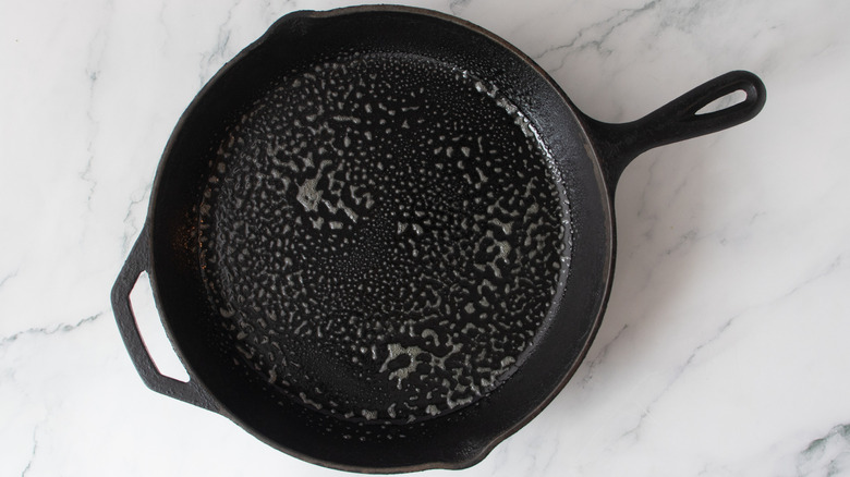 cast iron skillet with oil