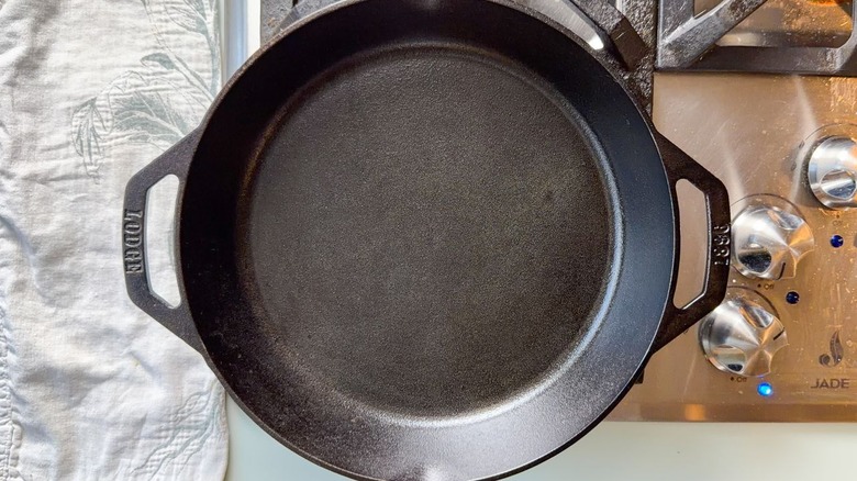 Cast iron skillet heating on stovetop
