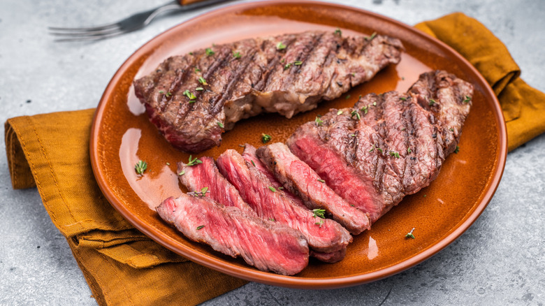 Grilled flat iron steak, partially sliced