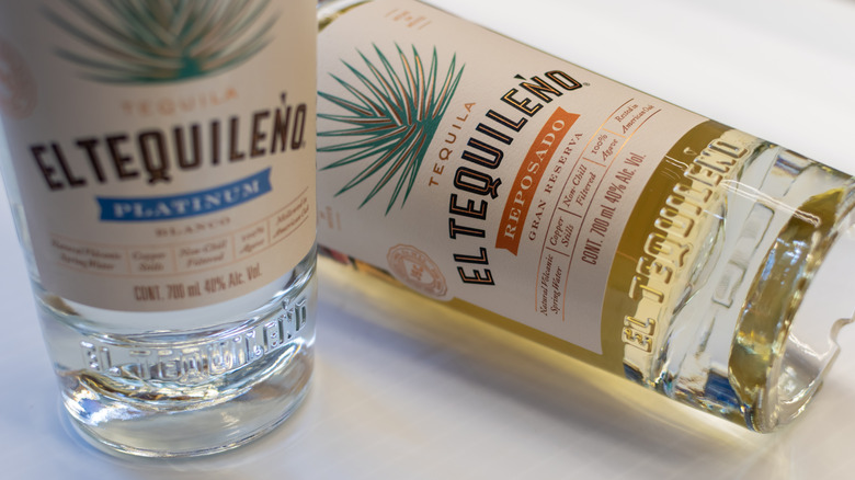 Two bottles of El Tequileño on a white background