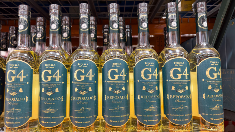 Bottles of G4 Reposado lined up on a shelf