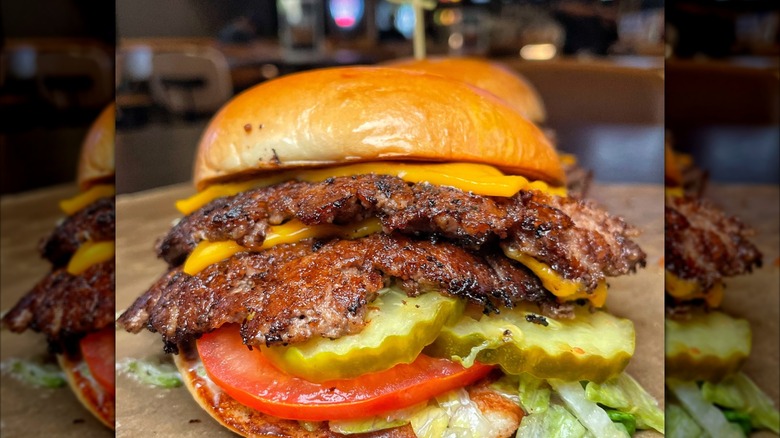 Buffalo Wild Wings double cheeseburger with pickles, lettuce, and tomato